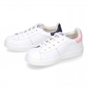 Washable leather school tennis shoes with shoelaces and stripes design.