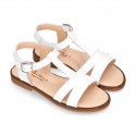 Patent Leather T-Strap Sandal shoes with crossed straps for girls.
