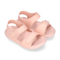 Kids Clog jelly shoes style in solid colors with double hook and loop strap closure design.