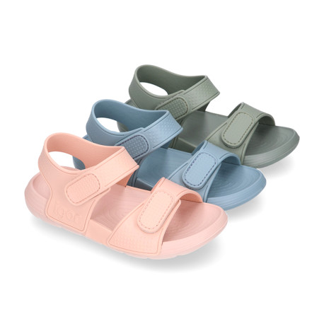 Kids Clog jelly shoes style in solid colors with double hook and loop strap closure design.