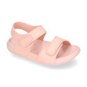 Kids Clog jelly shoes style in solid colors with double hook and loop strap closure design.