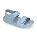 Kids Clog jelly shoes style in solid colors with double hook and loop strap closure design.