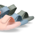 Kids Clog jelly shoes style in solid colors with double hook and loop strap closure design.