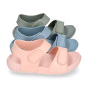 Kids Clog jelly shoes style in solid colors with double hook and loop strap closure design.