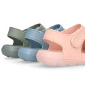 Kids Clog jelly shoes style in solid colors with double hook and loop strap closure design.