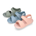 Kids Clog jelly shoes style in solid colors with double hook and loop strap closure design.