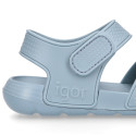 Kids Clog jelly shoes style in solid colors with double hook and loop strap closure design.