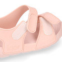 Kids Clog jelly shoes style in solid colors with double hook and loop strap closure design.