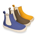 BAREFOOT Kids ankle shoes with elastic band and side zipper closure.