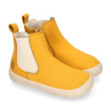 BAREFOOT Kids ankle shoes with elastic band and side zipper closure.