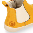 BAREFOOT Kids ankle shoes with elastic band and side zipper closure.