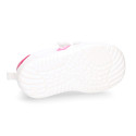 White color OKAA FLEX tennis kids shoes laceless and with toe cap.