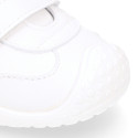 White color OKAA FLEX tennis kids shoes laceless and with toe cap.